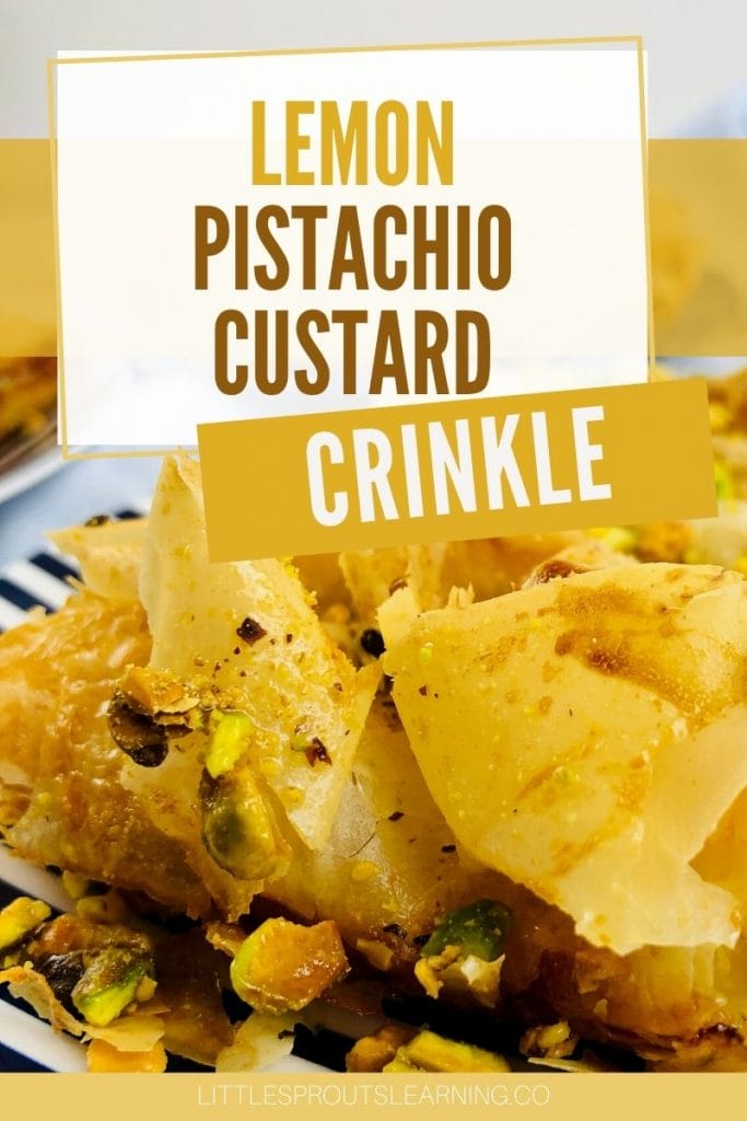 lemon pistachio custard crinkle cut into a serving and placed on a black and white striped plate