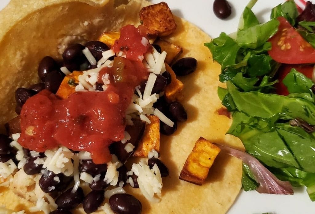 freezer chicken burrito on a plate with salad