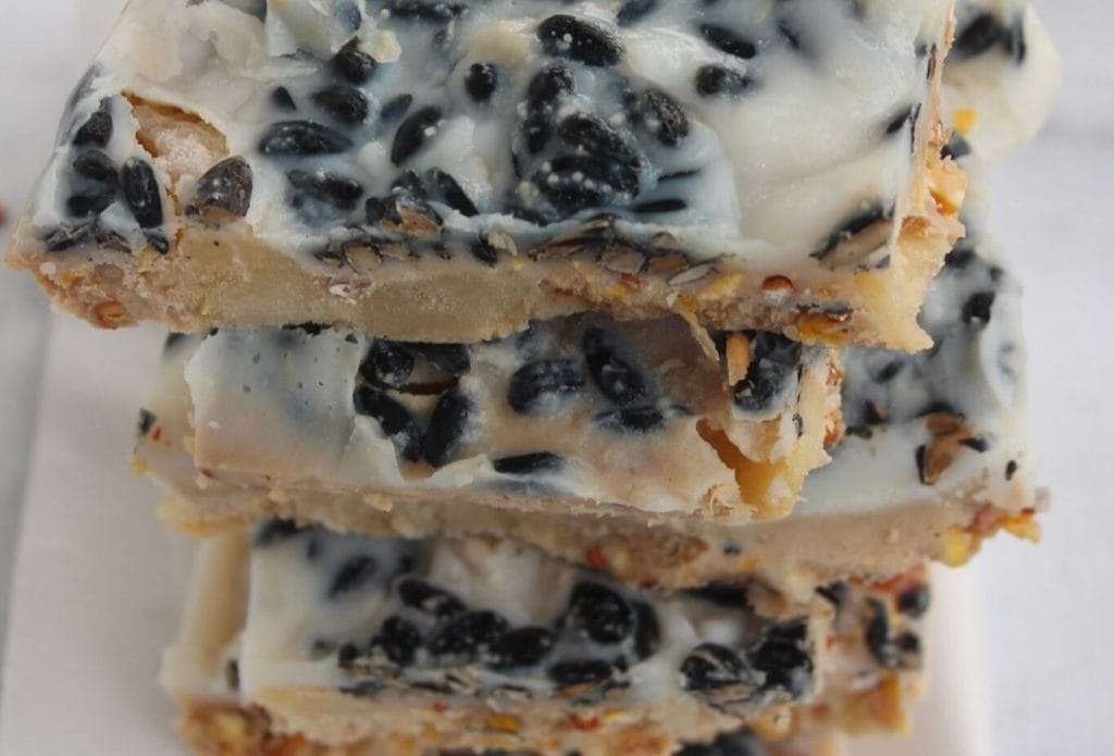 peanut butter pear bird suet cakes in a stack on a piece of parchment