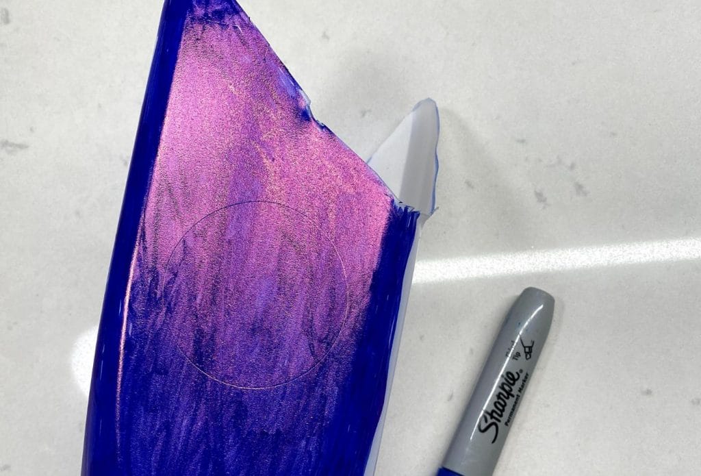 milk carton for catcher being colored with sharpie