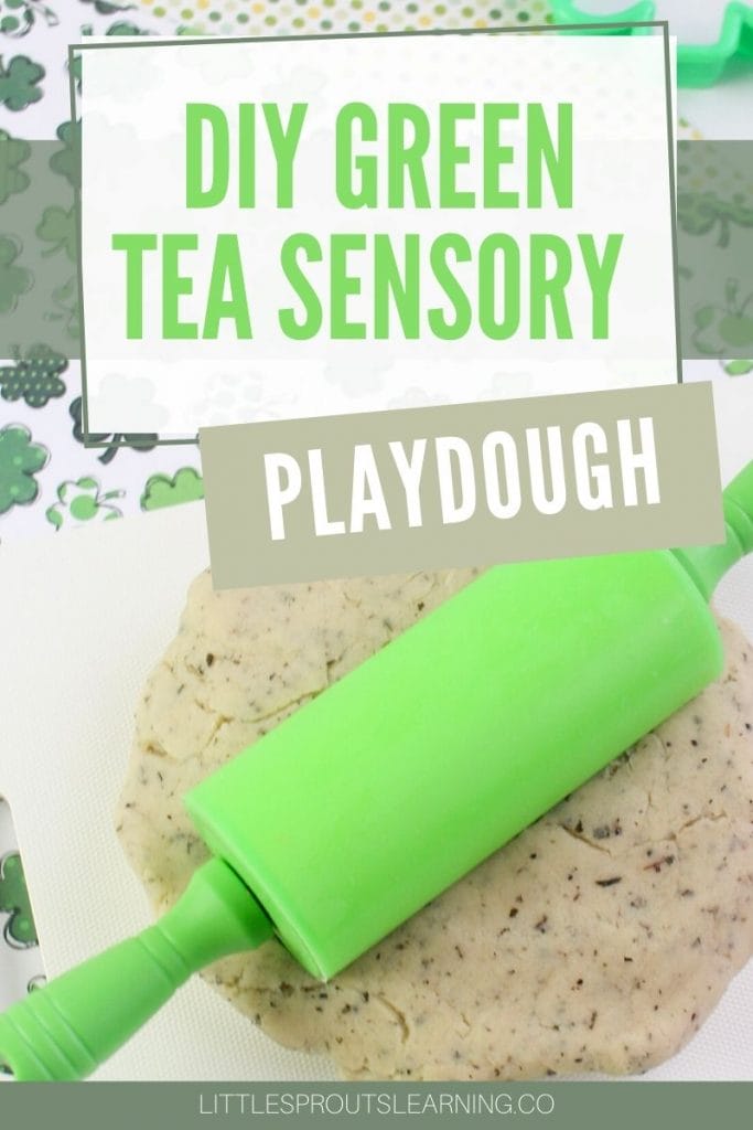 Green Tea sensory playdough rolled out on a mat with a green rolling pin