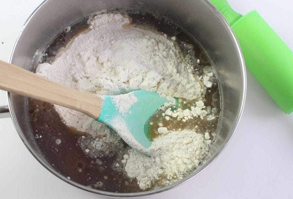 ingredients for homemade playdough being mixed together