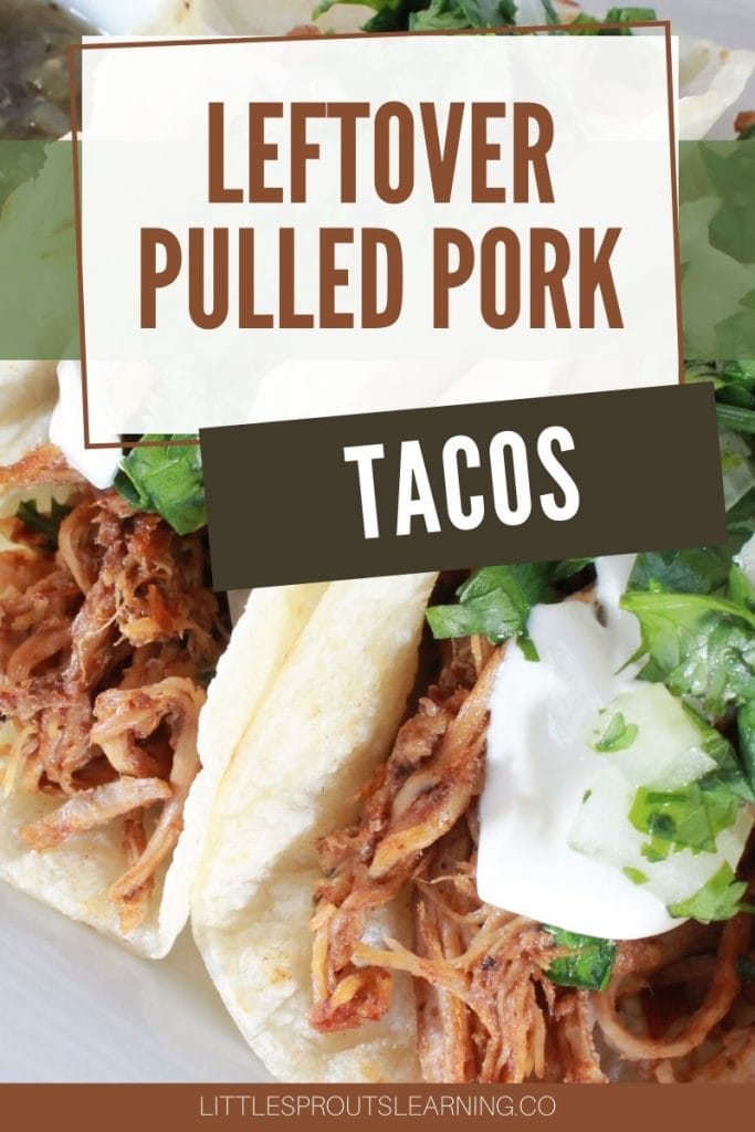 leftover pulled pork tacos on a plate garnished with sour cream and cilantro