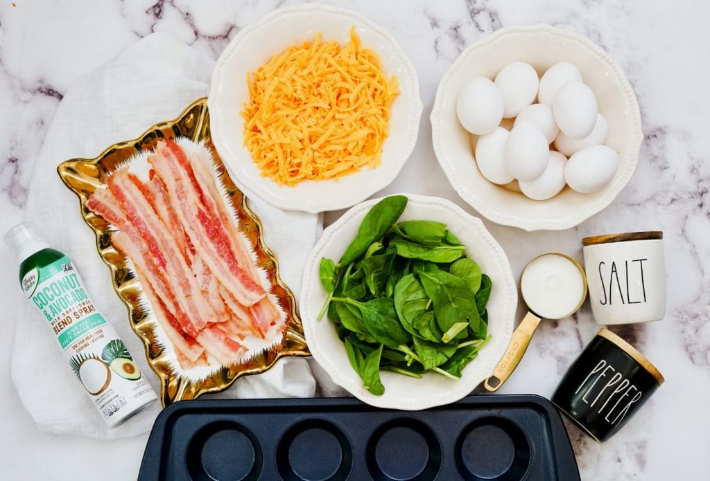 ingredients for spinach egg muffins on a counter