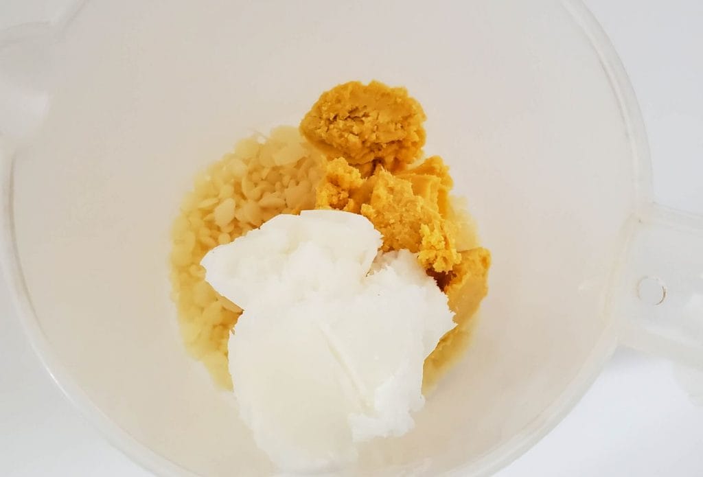 mixing lotion bar ingredients in a bowl