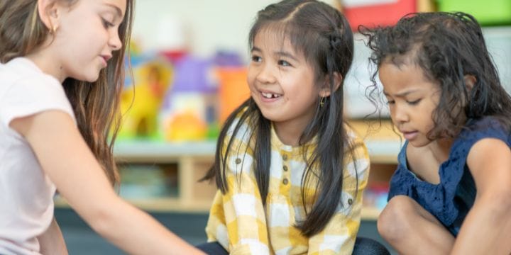 friends smiling and playing together