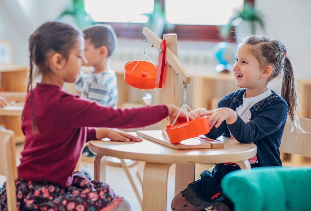 kids playing at a table together