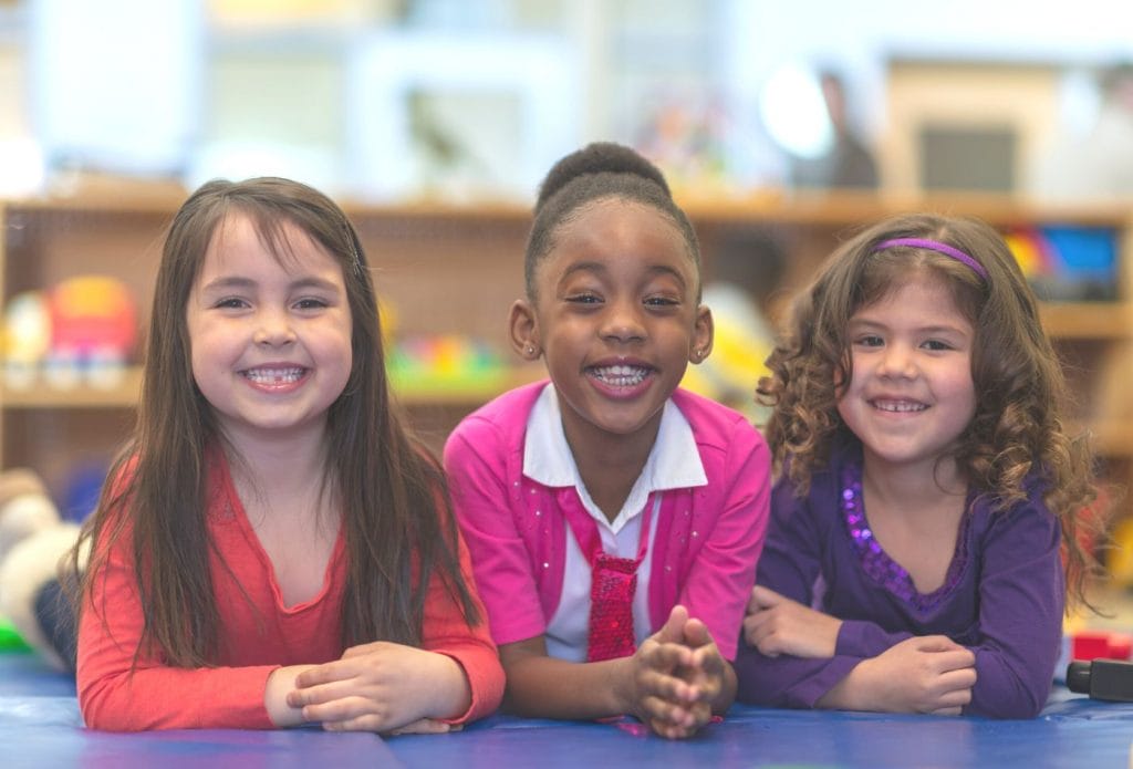preschool friends smiling together