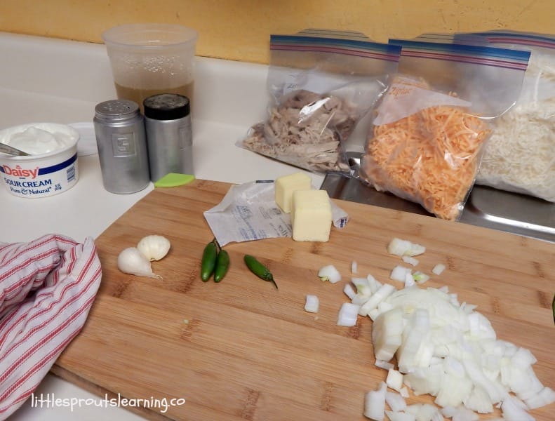 ingredients for leftover chicken enchiladas on a board