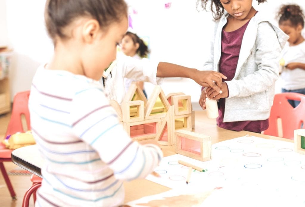 kids building with blocks together