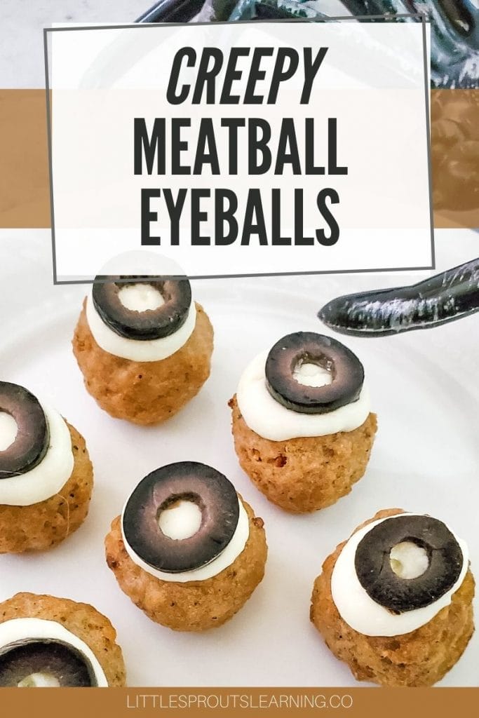 a plate of creepy meatball eyeballs with a giant plastic spider