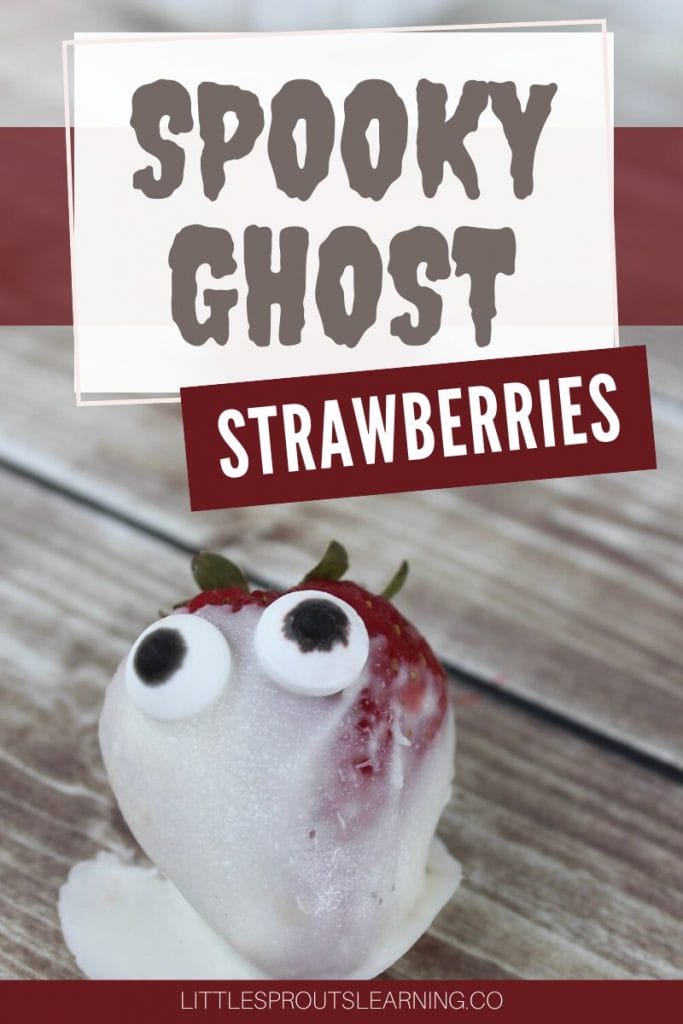 spooky ghost strawberries on a board