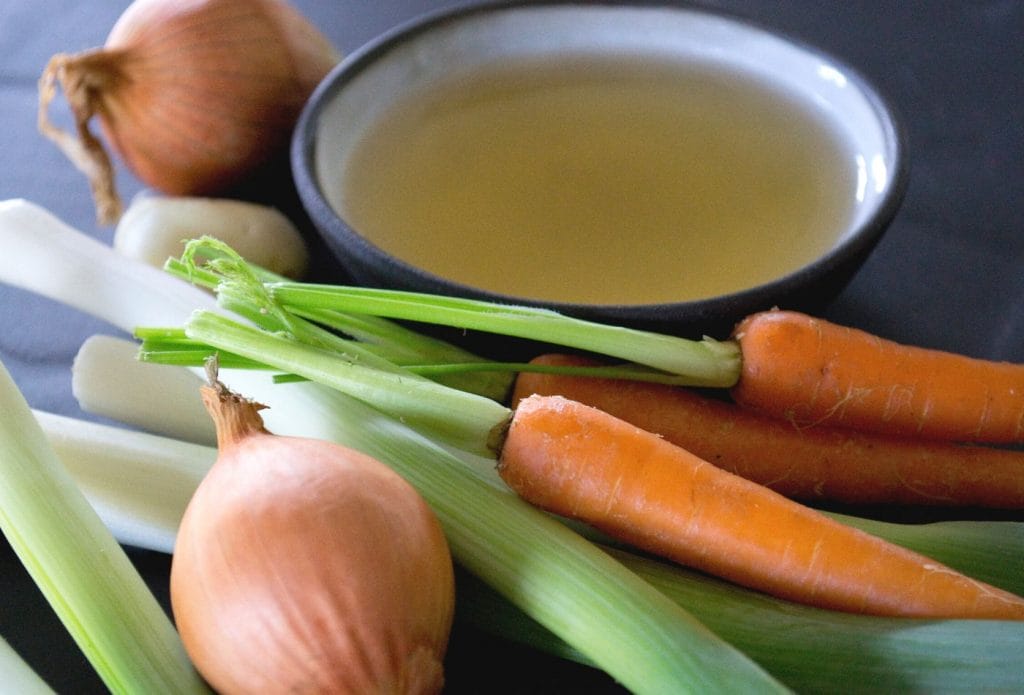 vegetables and a bowl of broth