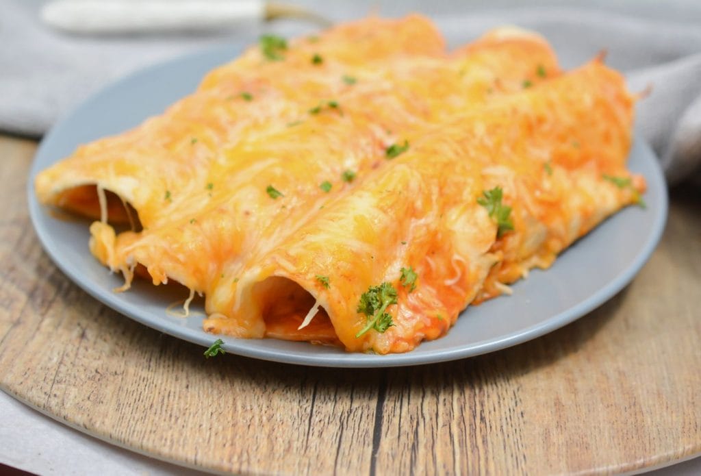 3 beef enchiladas on a plate