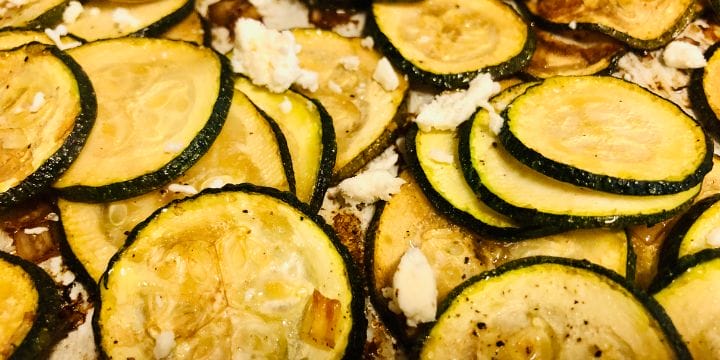 balsamic roasted zucchini with feta on a sheet pan