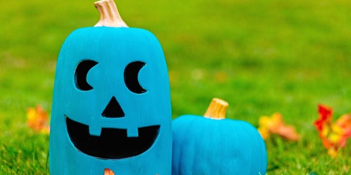 teal pumpkins in the grass