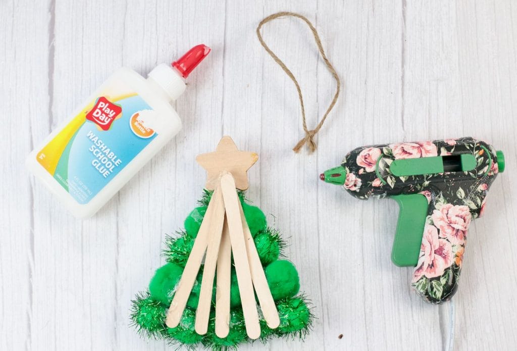 hot glue gun with pom pom christmas tree from the back