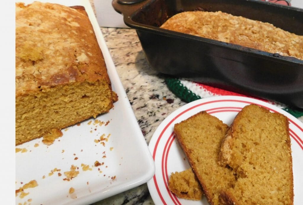 homemade peach and pumpkin sweet bread sliced up on a plate