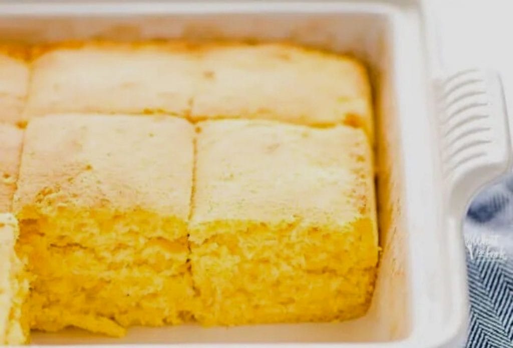 homemade sourdough cornbread in a pan cut into slices
