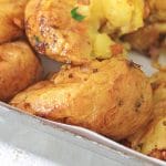 crispy air fried smashed potatoes on a pan