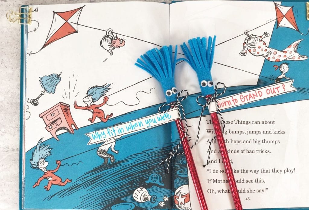 thing 1 and thing 2 pencils on a book