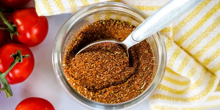 fajita seasoning mix in a jar with a spoon