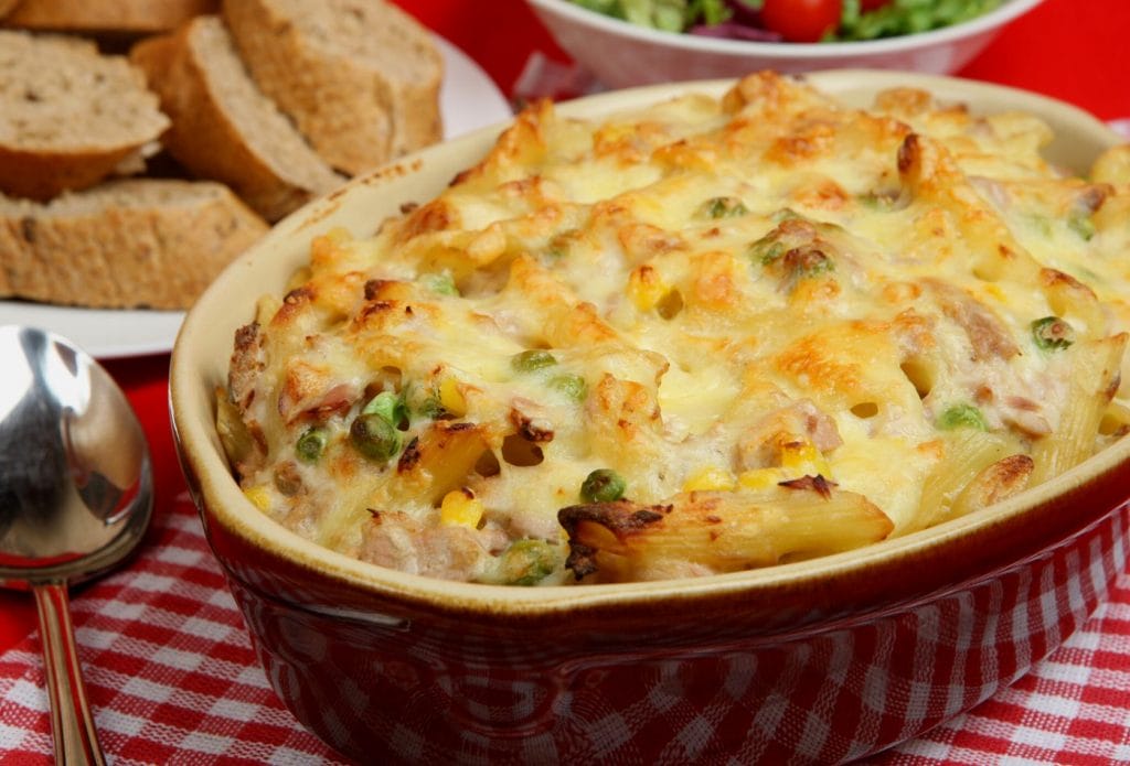 tuna pasta bake on the table with bread and salad