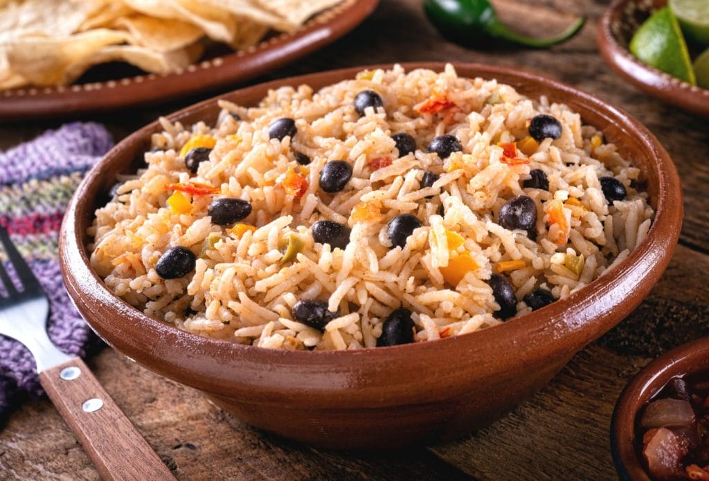 beans and rice in a bowl on the table