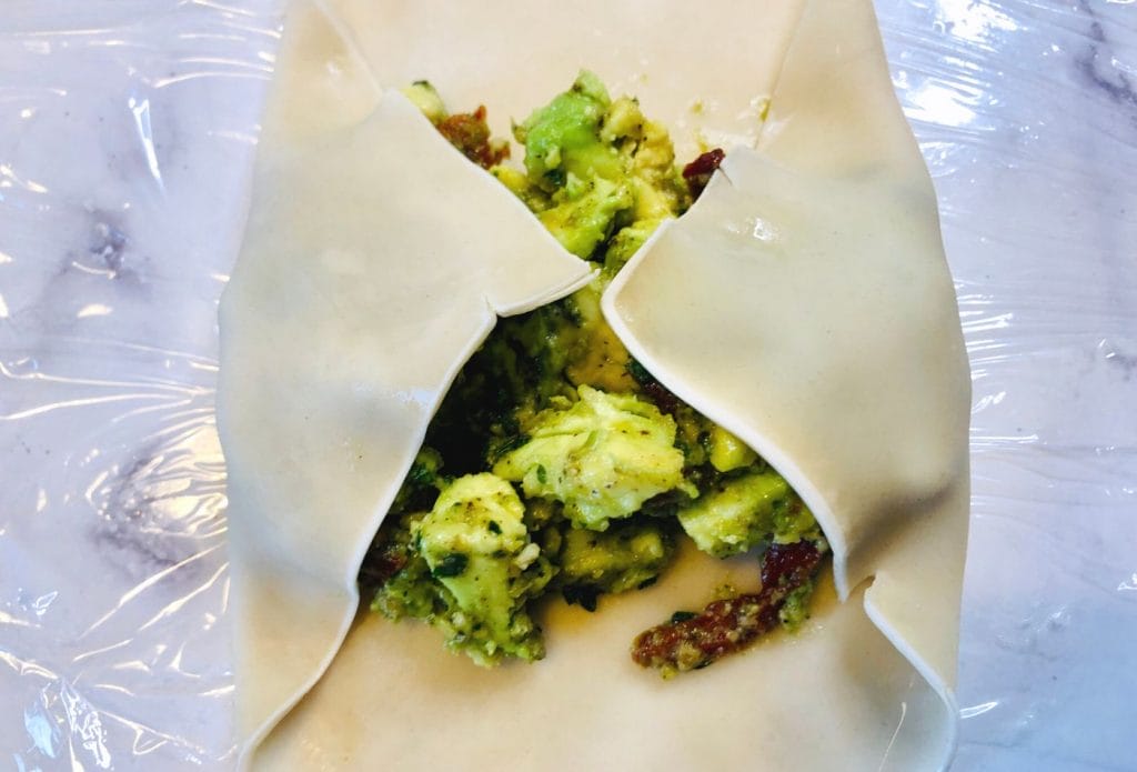 egg roll wrapper full of avocado filling