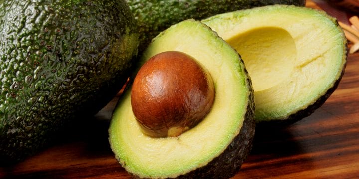 avocado halves on a board
