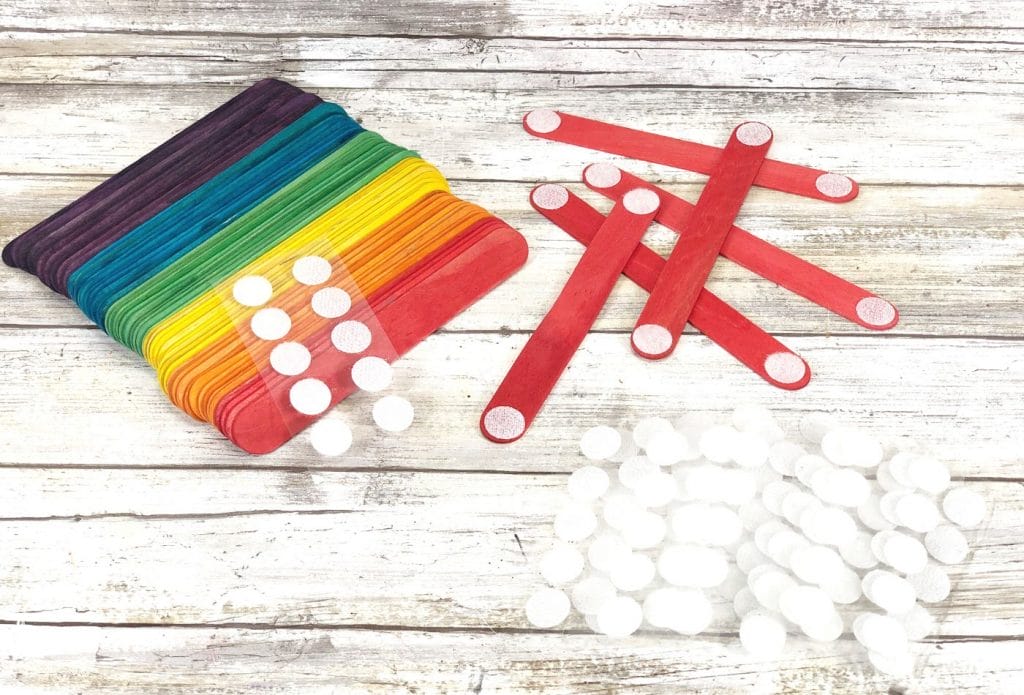 craft stick building set making supplies on a table