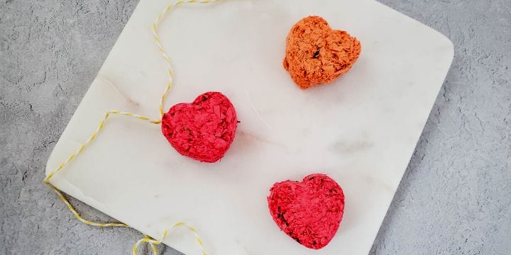heart seed bombs on a plate with yellow string