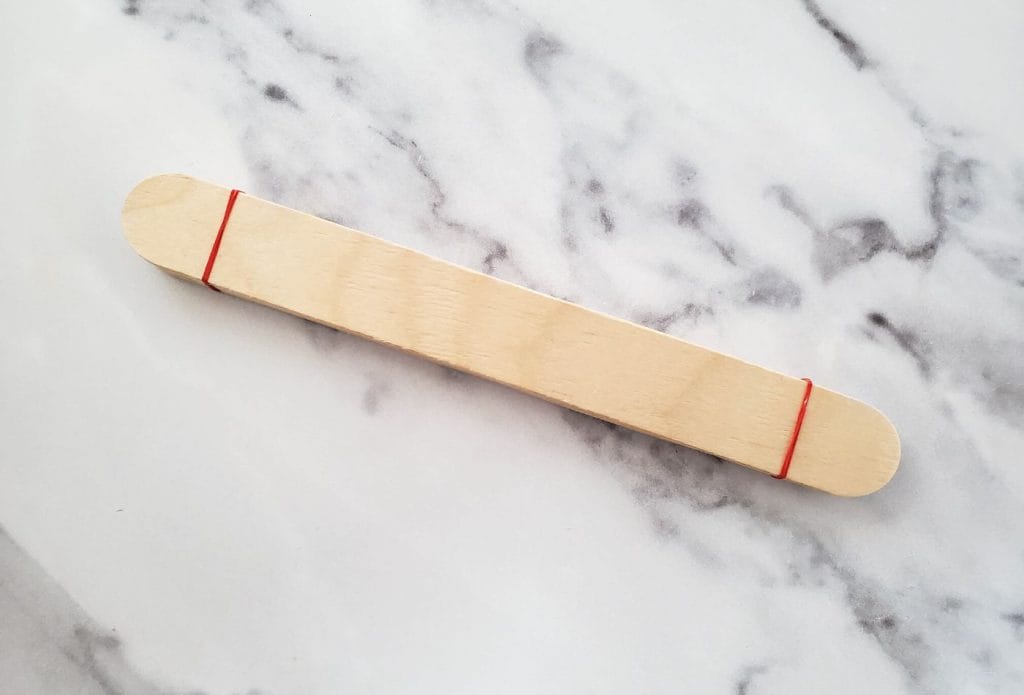 sticks banded together to make catapult