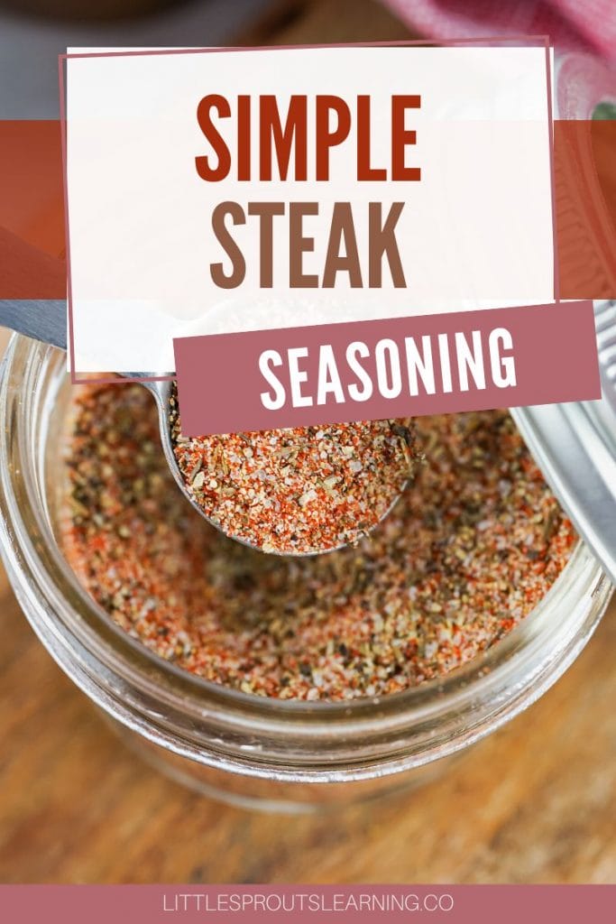 jar of simple steak seasoning with a spoon scooping some out.