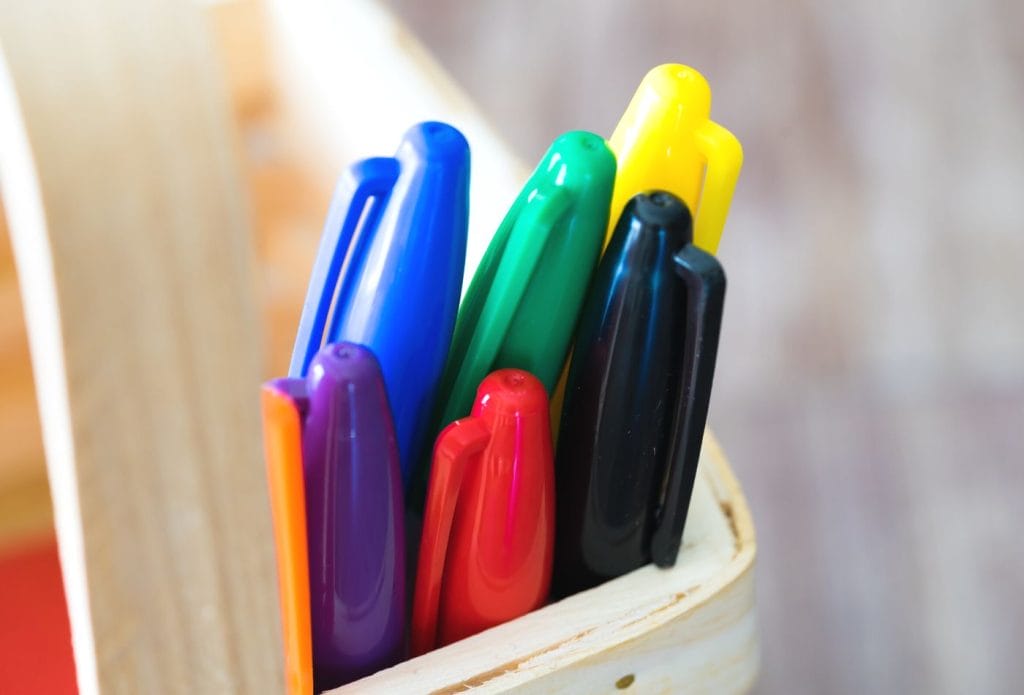 sharpie markers in a basket