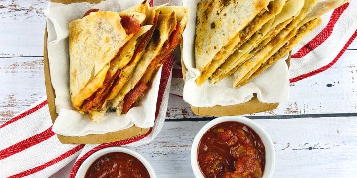 pizza quesadillas and taco quesadillas cut and placed in serving boats with dipping sauce
