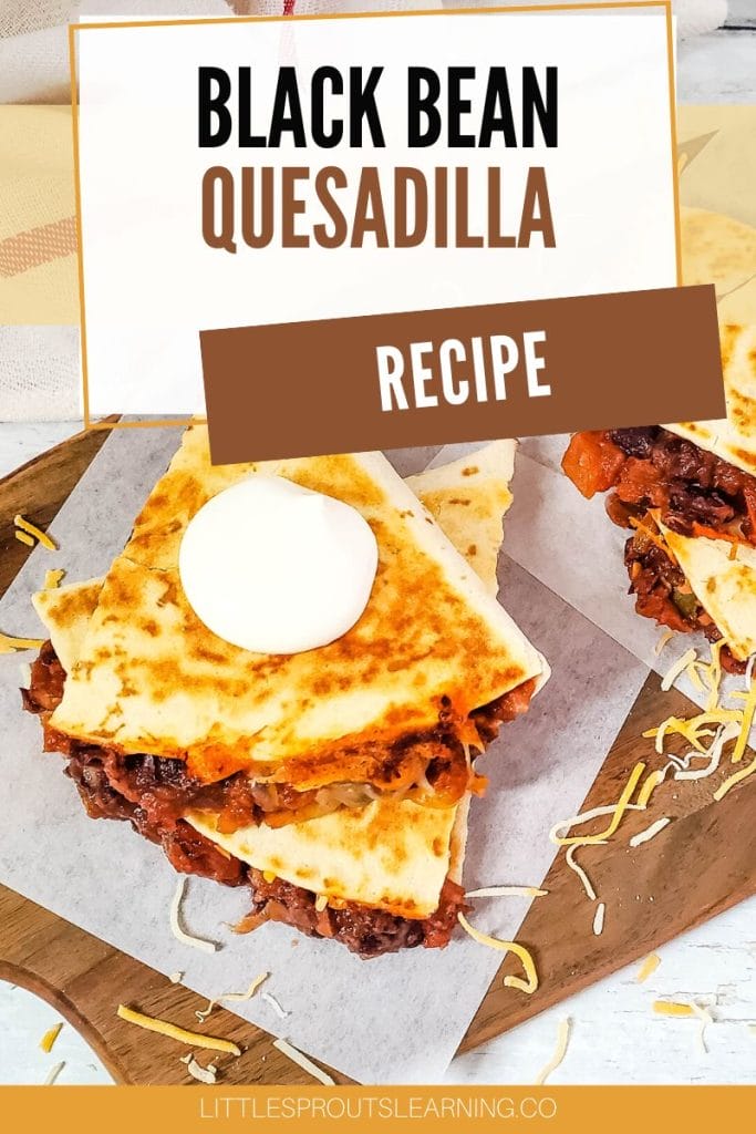 black bean quesadilla recipe cut in quarters on papers on a board