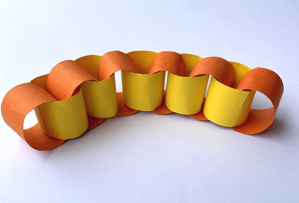 orange and yellow paper chain on a board