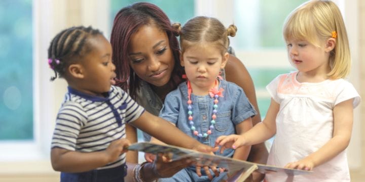 grown up woman teaching kids kindness