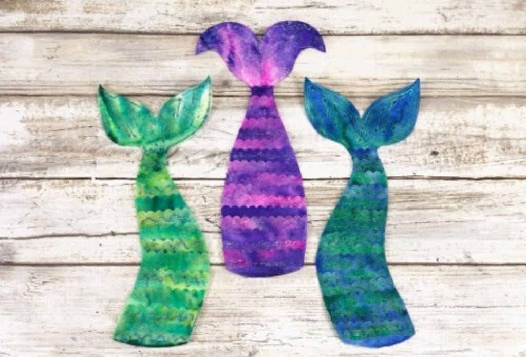 coffee filter mermaid bookmarks on a counter
