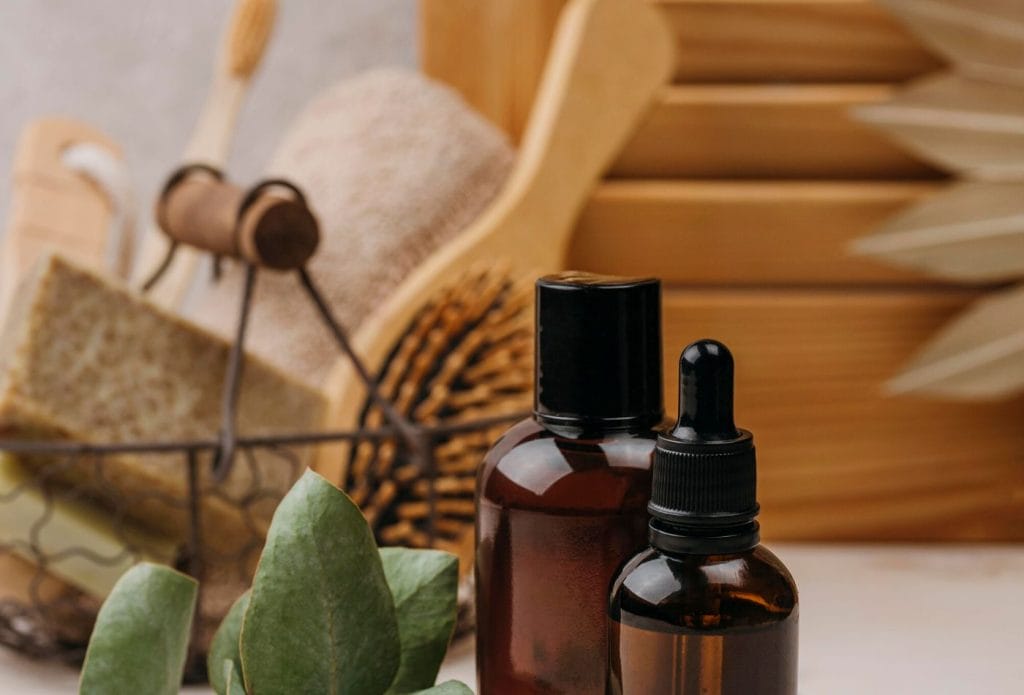 bath stuff on a counter with body oil in a jar