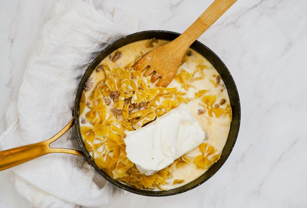 cheeseburger pasta in a skillet being cooked