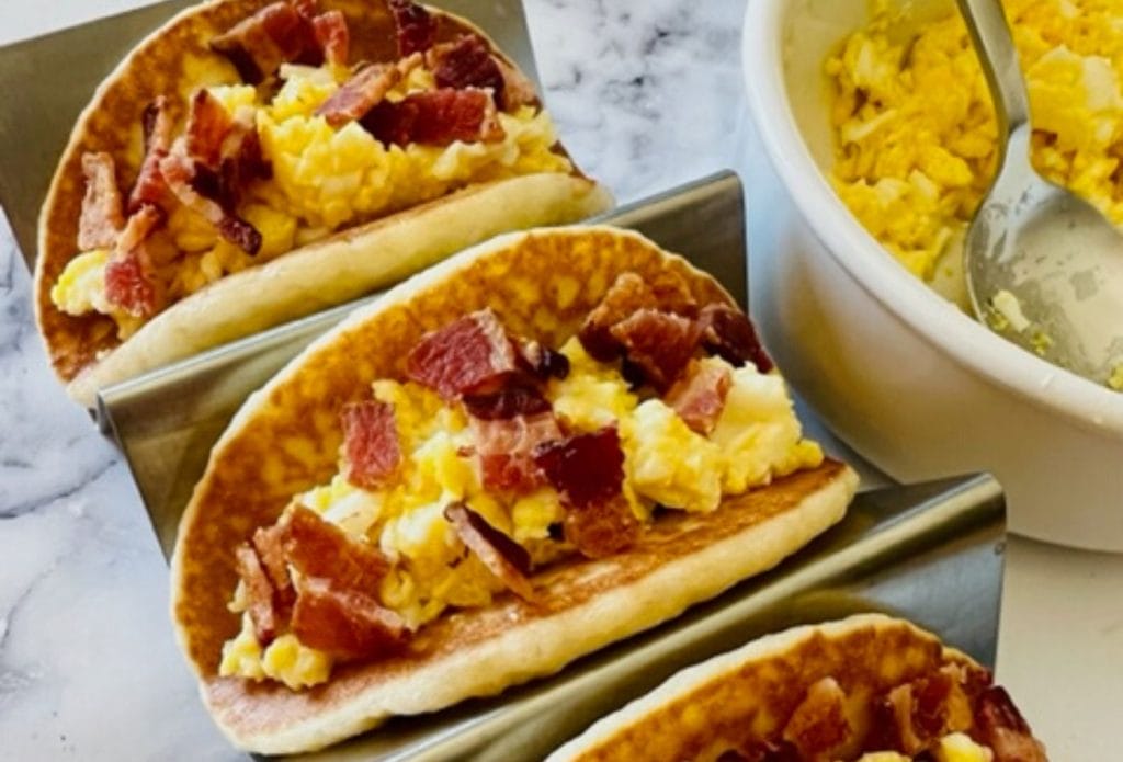 scrambled eggs and bacon in a pancake