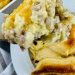 a bit of breakfast pot pie on a fork above a bowl full