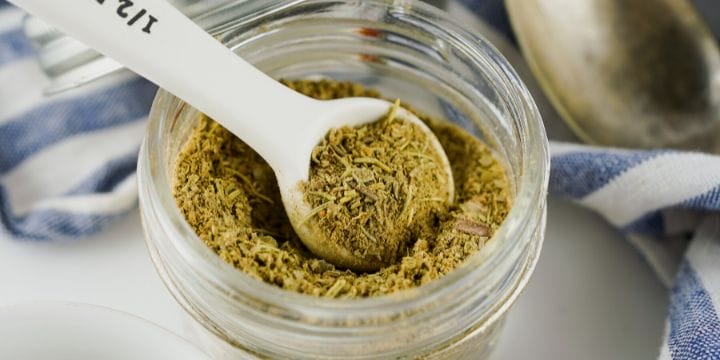 poultry seasoning mix in a jar with a spoon