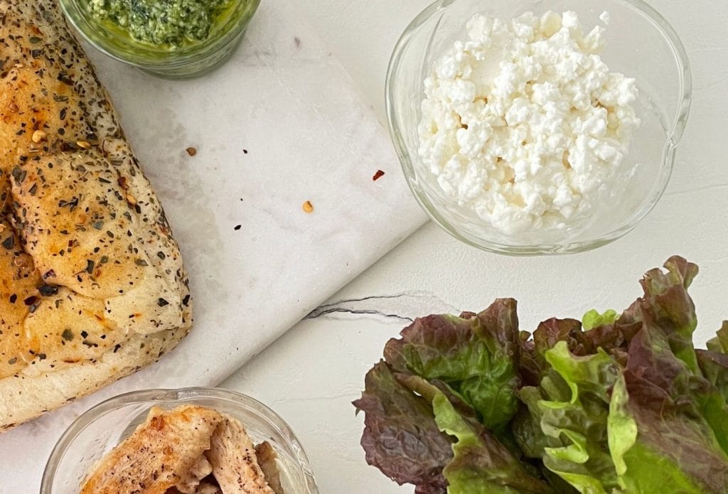 ingredients on a board for chicken focaccia sandwiches