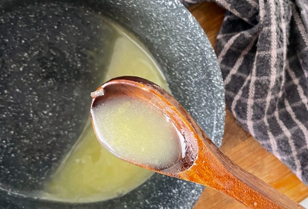 lemon juice and zest cooking in a pan