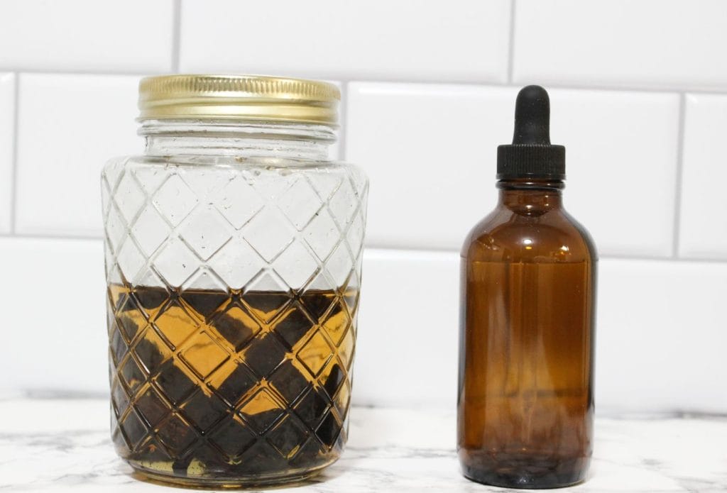 freshly made vanilla extract and a bottle to put it in