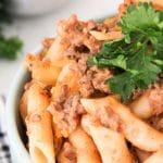 pasta with ground beef and tomato sauce in a bowl