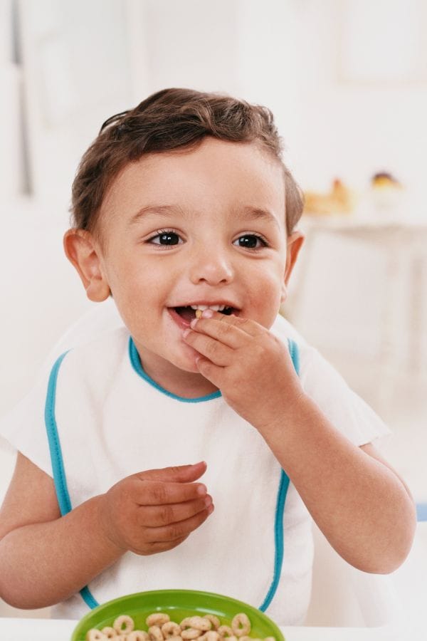 a child happily eating food